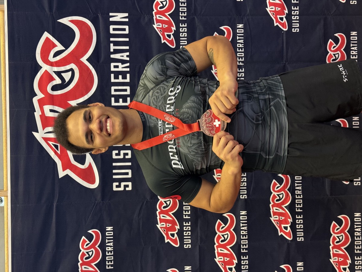 Daniel Caetano with a medal from a recent BJJ competition